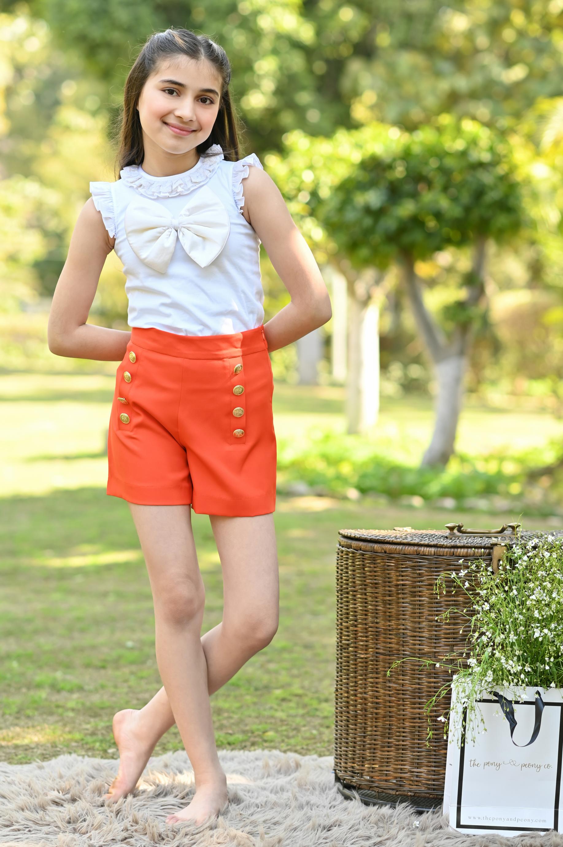WHITE BOW TOP & ORANGE SHORTS SET