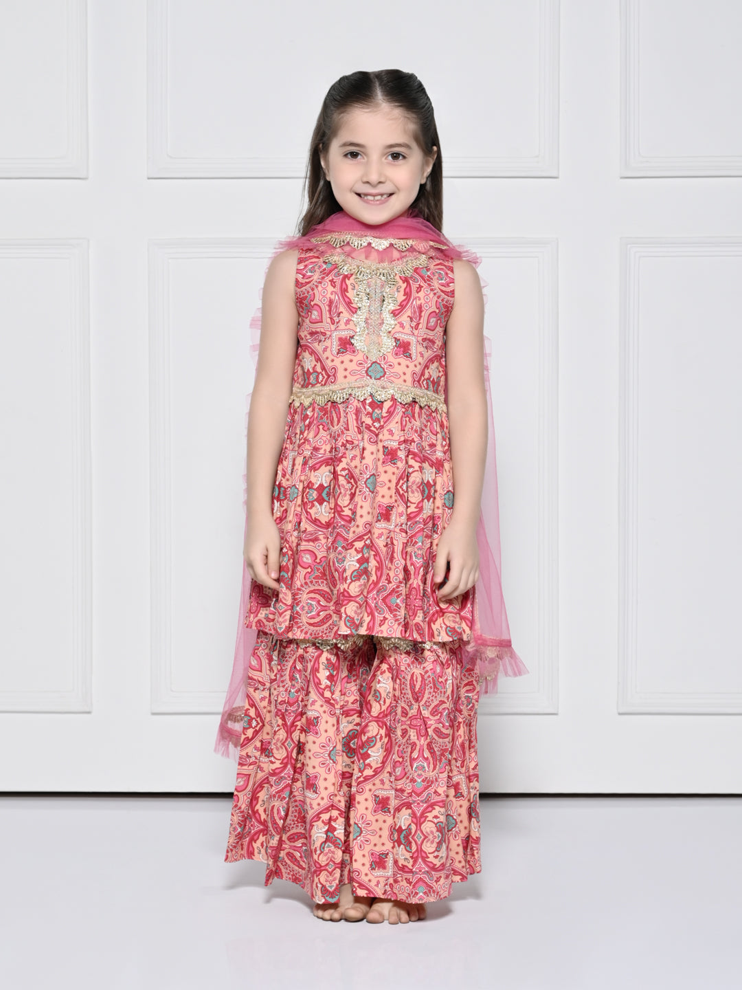 Peach and Pink Abstract – A Peach and Pink Sleeveless Rayon Suit for Girls