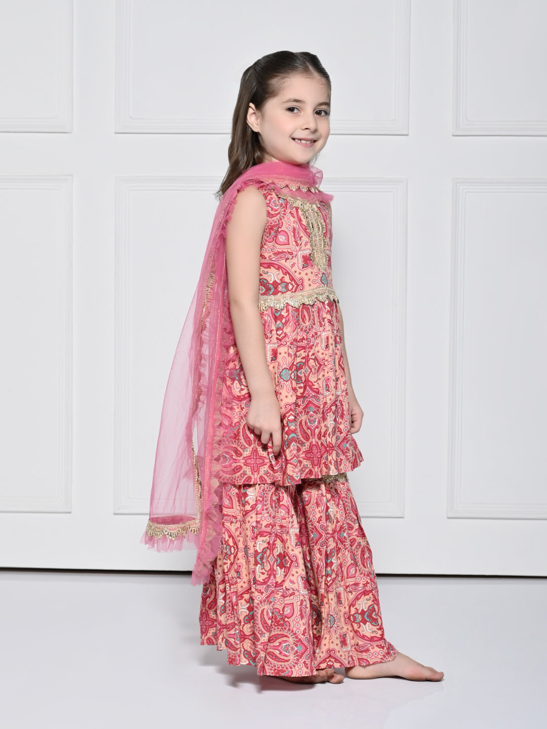 Peach and Pink Abstract – A Peach and Pink Sleeveless Rayon Suit for Girls