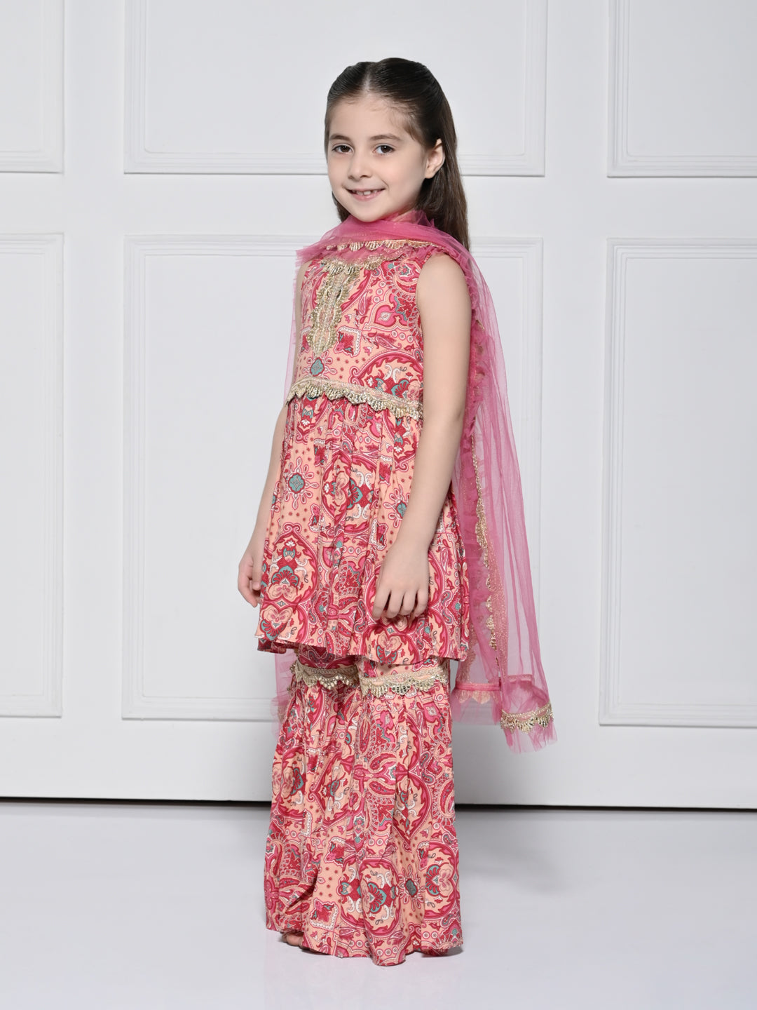 Peach and Pink Abstract – A Peach and Pink Sleeveless Rayon Suit for Girls