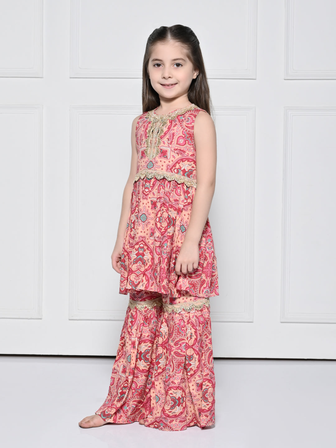 Peach and Pink Abstract – A Peach and Pink Sleeveless Rayon Suit for Girls