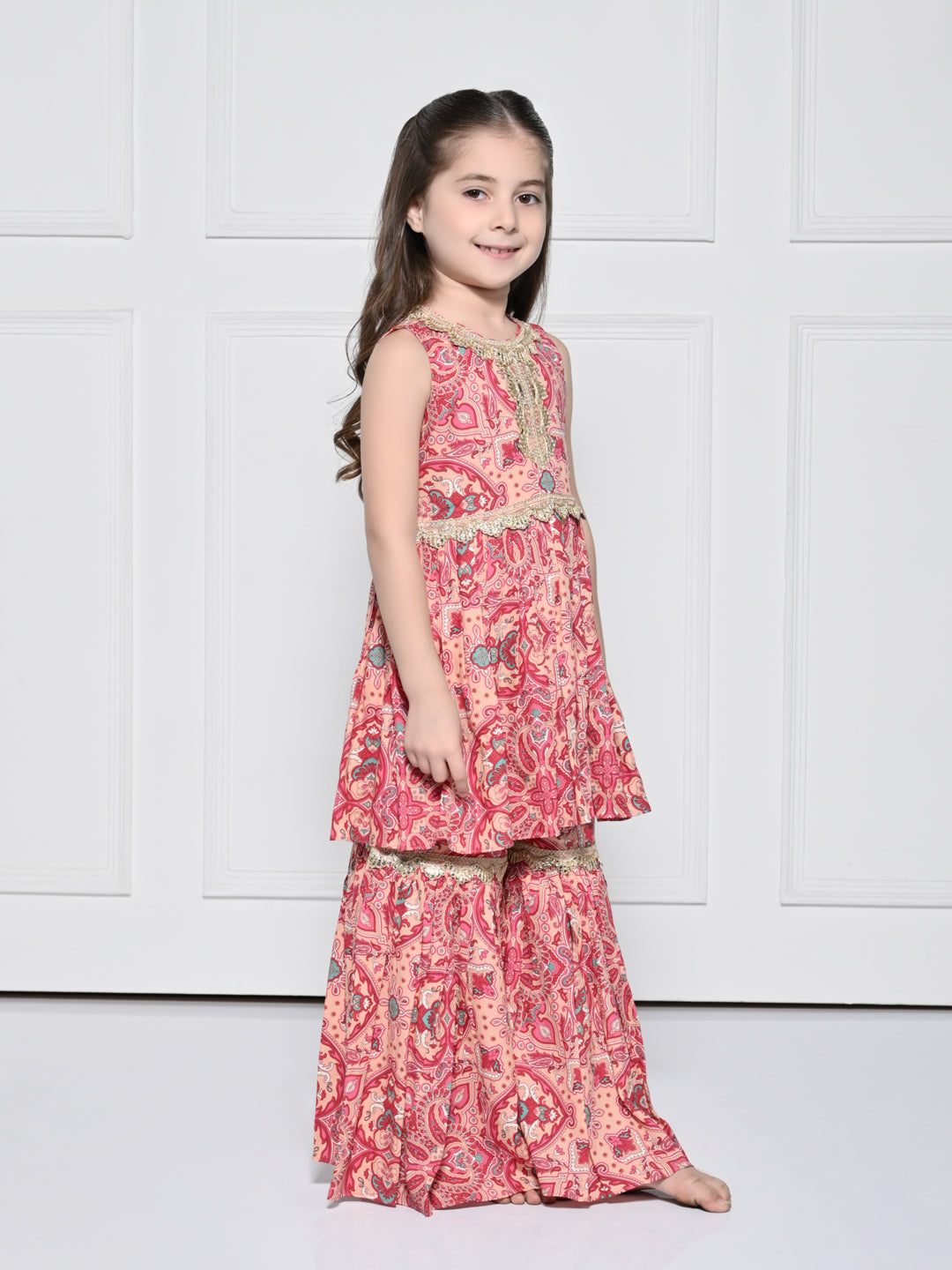 Peach and Pink Abstract – A Peach and Pink Sleeveless Rayon Suit for Girls